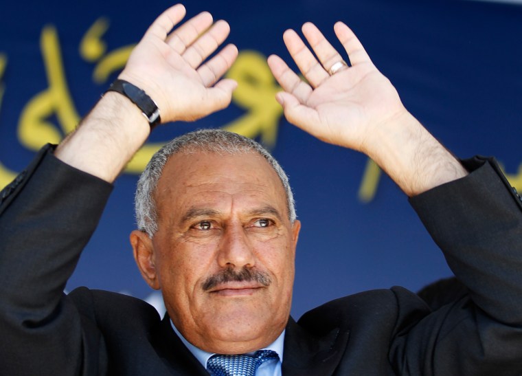 Image: Yemen's President Saleh waves to supporters gathered in a soccer stadium in Sanaa