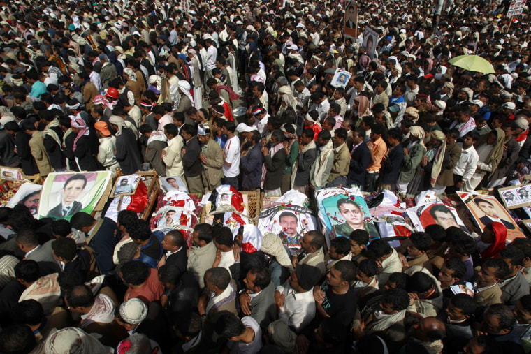 Image: Mourners pray during the funeral of anti-government protesters in Sanaa