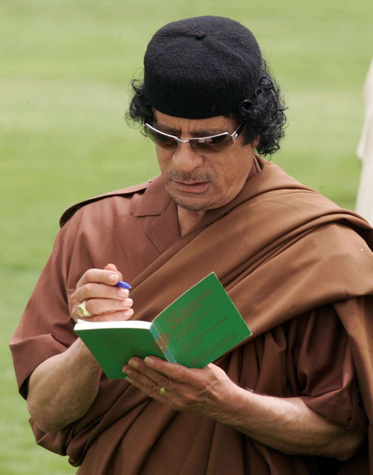 Image: Vladimir Putin Meets With Libyan Leader Moamer Kadhafi