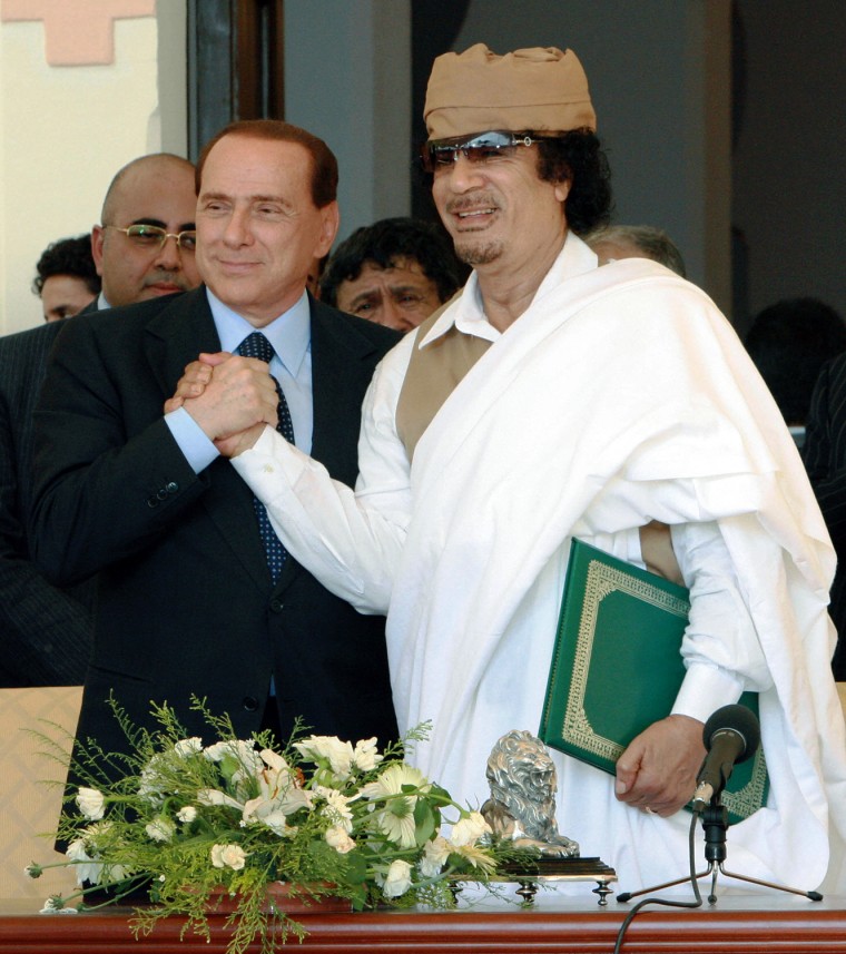 Image: Libyan leader Moamer Kadhafi and Italian
