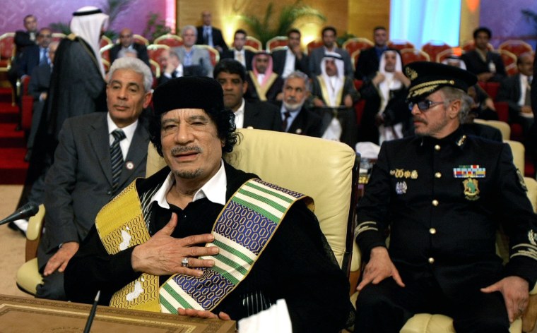 Image: Libyan leader Moamer Kadhafi gestures as