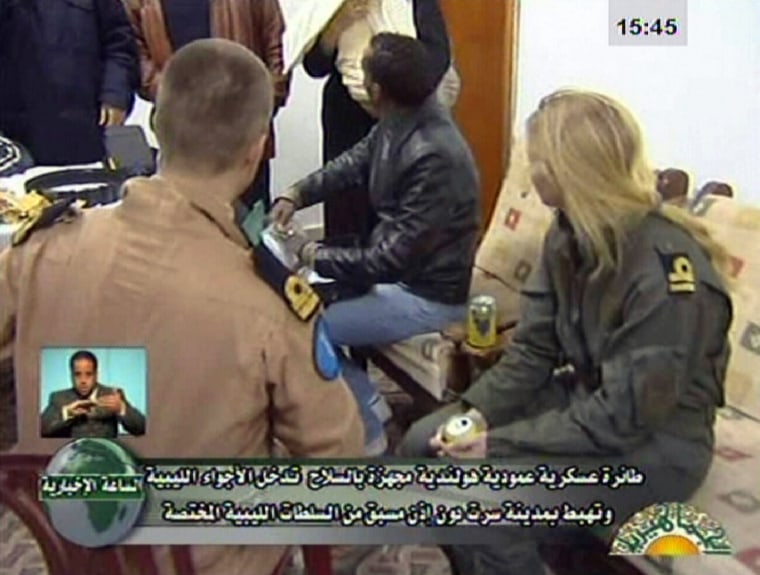 Image:  two of the three Dutch soldiers (L, and R) captured by Libyan armed forces while attempting to rescue civilians