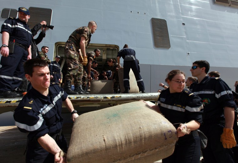 Image: French navy ship Mistral in Zarzis Tunisia port delivering aid for workers who fled Libya conflict