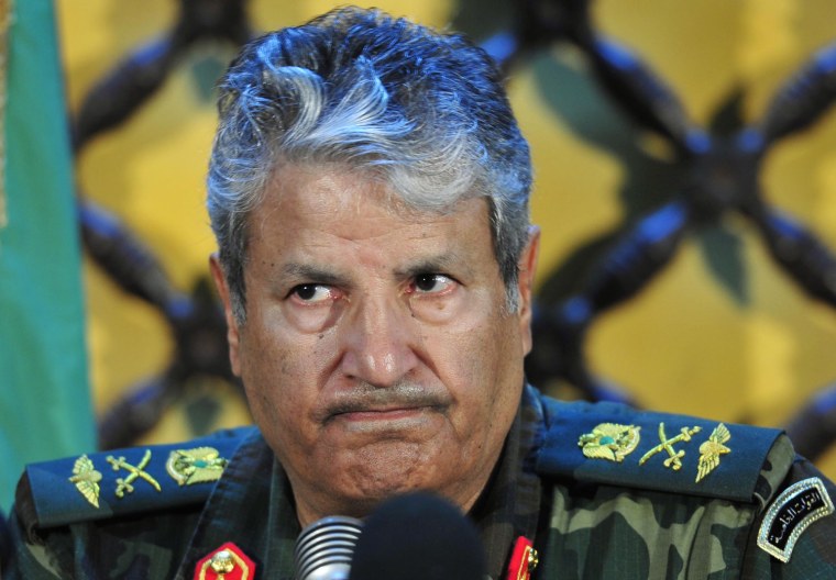 Image: Head of the rebel forces Younes gestures during a news conference in Benghazi