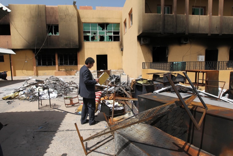 Image: Destruction following days of clashes between anti Gaddafi rebels and those loyal to Gaddafi