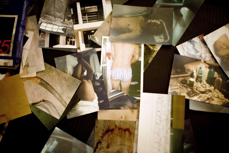 Image: Photographs that officials claim show bodies and scenes of tortue.