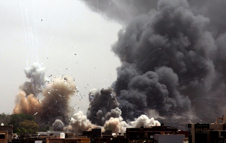 Fires burn as explosions erupt near compound of Gadhafi’s residence in Tripoli on June 7, 2011. The complex was consistently targeted by a NATO air campaign.