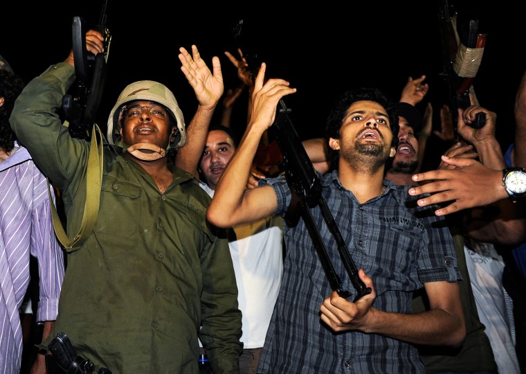 Image: Supporters of Libyan leader Muammar Gaddafi gather outside the Bab al-Aziziyah compound in Tripoli