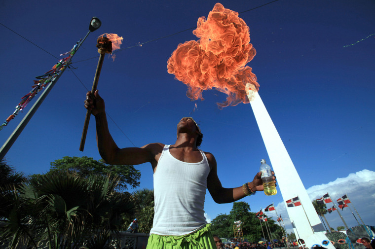 Image: A fire breather performs during a carniv