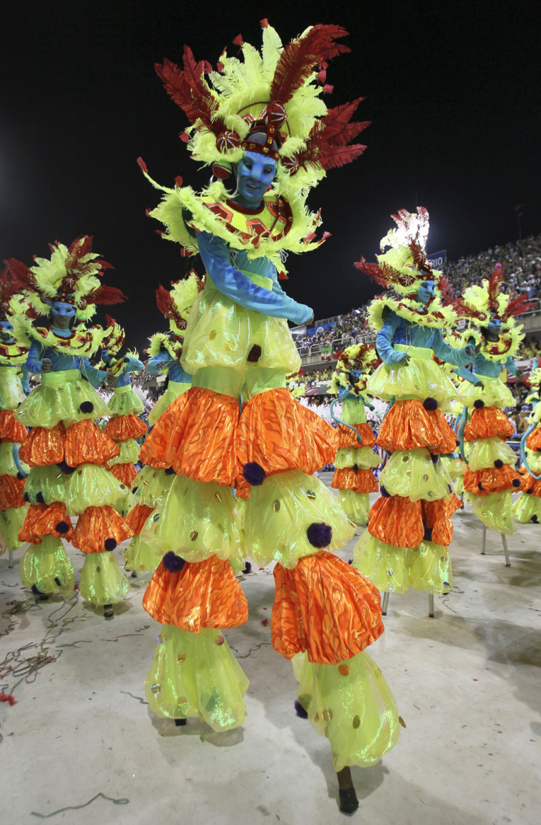 Image: Revelers of the Salgueiro samba school participate in the Carnival parade in Rio