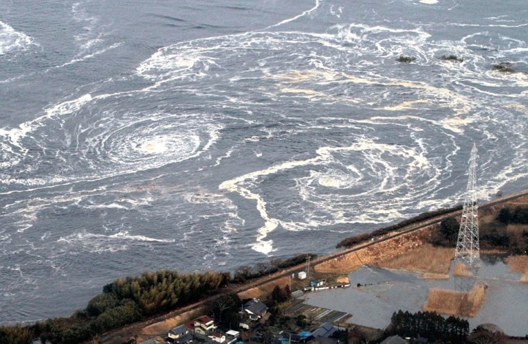 Image: Whirlpools are seen following a tsunami and earthquake in Iwaki city