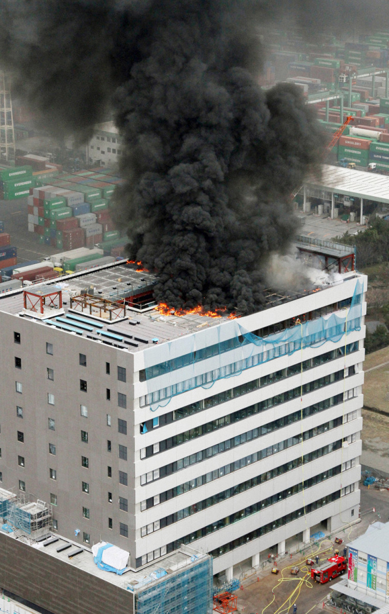 Image: An office building burns in Tokyo after an earthquake