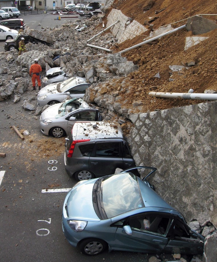Image: Vehicles are crushed by a collapsed wall