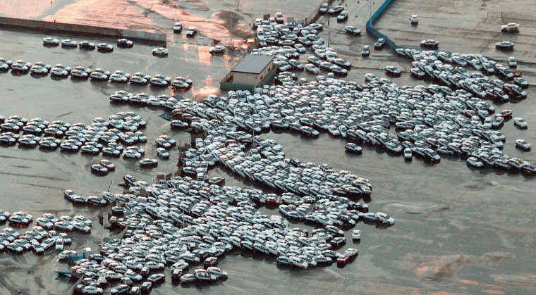Image: An aerial shot shows vehicles ready for