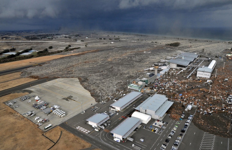 Image: Sendai Airport is swept by a tsunami after an earthquake, in northeastern Japan