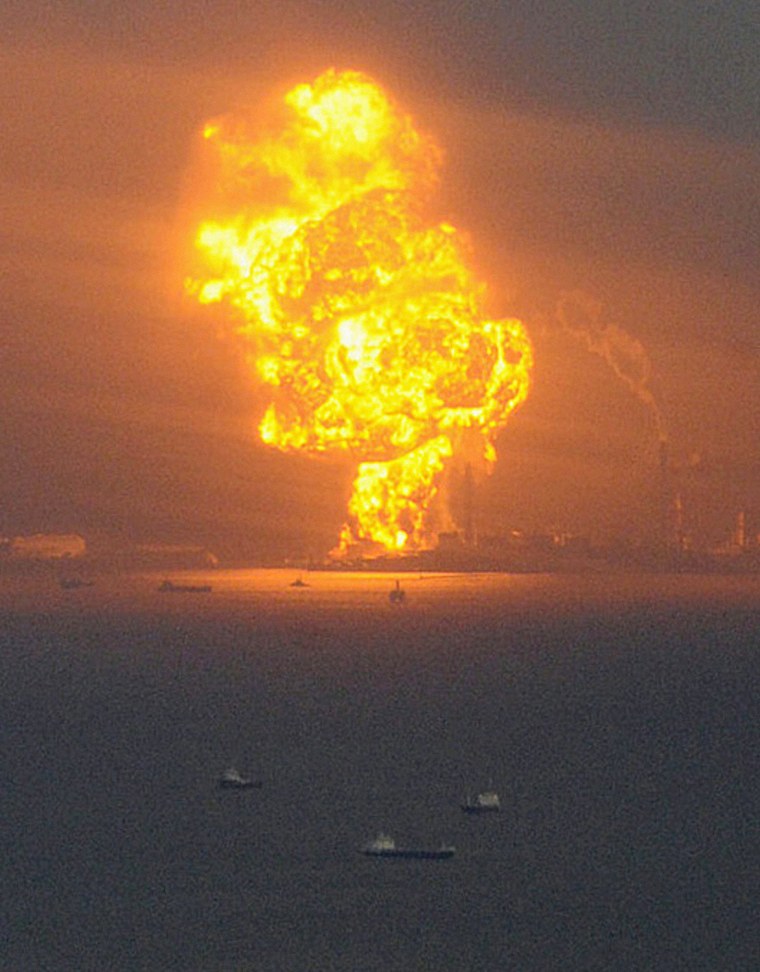 Image: Natural gas containers burn at a facility following an earthquake in Chiba Prefecture near Tokyo