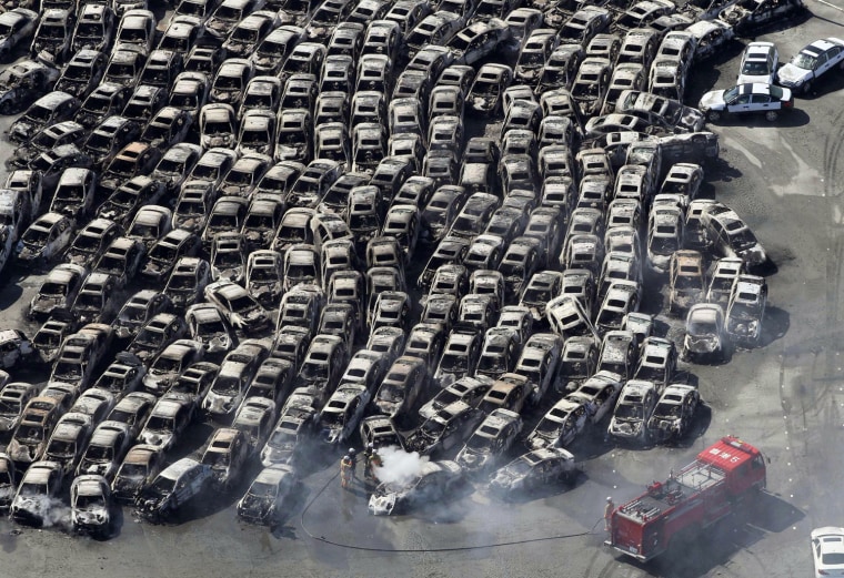 Image: Cars swept by a tsunami are seen after an earthquake in Hitachi City