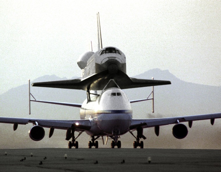 Endeavour Goes to Florida May 2, 1991.
NASA's 747 Shuttle Carrier Aircraft No. 911, with the space shuttle orbiter Endeavour securely mounted atop its fuselage, taxies to the runway to begin the ferry flight from Rockwell's Plant 42 at Palmdale, California, where the orbiter was built, to the Kennedy Space Center, Florida. At Kennedy, the space vehicle was processed and launched on orbital mission STS-49, which landed at NASA's Ames-Dryden Flight Research Facility (later redesignated Dryden Flight Research Center), Edwards, California. NASA 911, the second modified 747 that went into service in November 1990, has special support struts atop the fuselage and internal strengthening to accommodate the added weight of the orbiters.