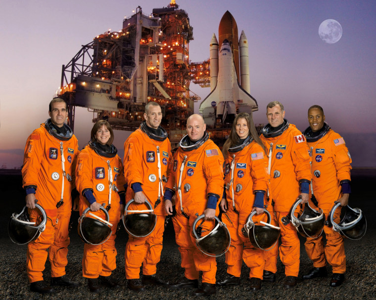The STS-118 crew pose for their official portrait on Aug. 8, 2007. Rick Mastracchio, from left, Barbara R. Morgan, pilot Charles Hobaugh, mission commander Scott Kelly, Tracy Caldwell, Canadian Space Agency astronaut Dave Williams and Alvin Drew.