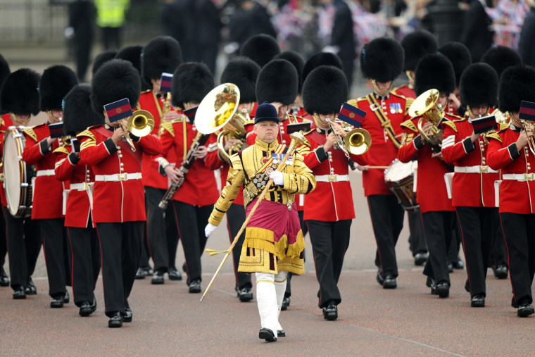 Image: A marching band of guardsmen parade along The Mall before the wedding of Britain's Prince William and Kate Middleton in central London