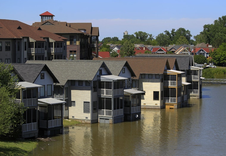 Image: Homes on Mud Island that are usually high above the water level are met by the rising waters of the Mississippi River in Memphis, Tenn.