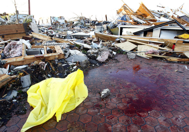 Image: A pool of blood is seen on the floor of a business establishment which was wiped out by a tornado in Joplin