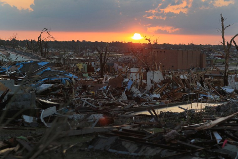 Image: Debris from destroyed homes are seen after a massive tornado passed through Joplin, Mo.