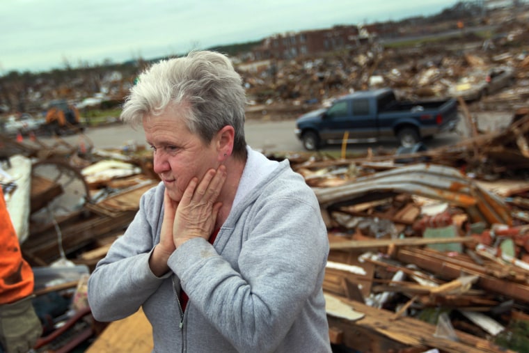 Image: Woman looks at tornado aftermath in Joplin, Missouri