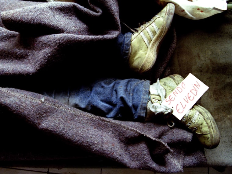 Image: File photo of younf Bosnian war victim lying in a morgue in Sarajevo