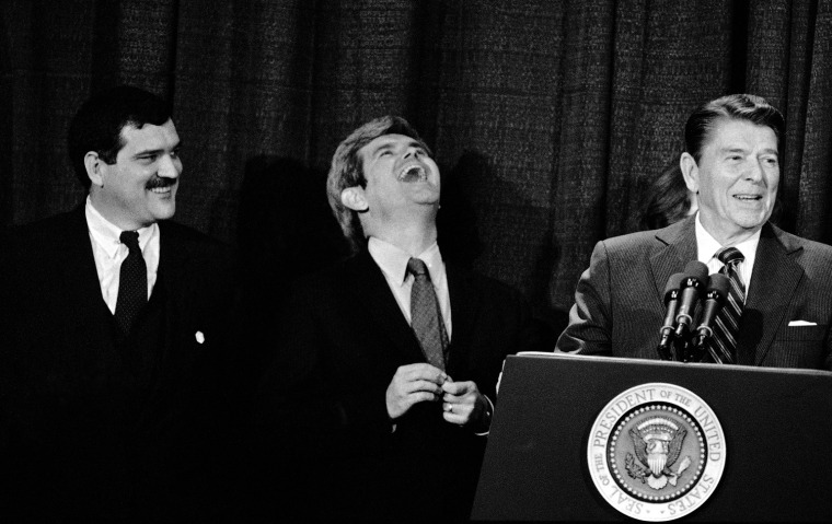 United States Representative from Georgia Newt Gingrich laughs at a joke told by President Ronald Reagan during one of his speeches, Thursday, January 26, 1984 in Atlanta. (AP Photo/Joe Holloway, Jr.)