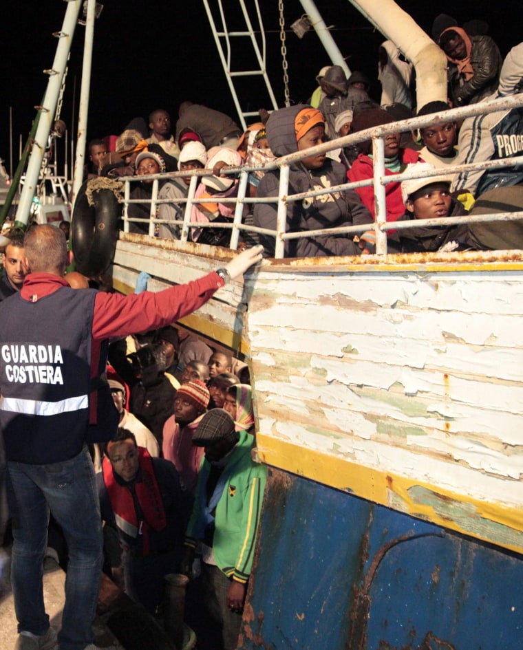 Image: Libyan refugees arrive on the island of Lampedusa,