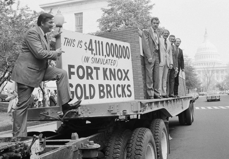 Rep. George Hansen, R-Idaho, left, and other members of Congress gather around a truck loaded with 44,300 simulated gold bricks on Wednesday, April 25, 1979 in Washington to indicate their strong opposition to the estimated $4.1 billion dollars it will cost the U.S. taxpayers to give away the Panama Canal. From left are Hansen, Reps. Ron Paul, Texas; Floyd Spence, R-S.C.; William Dannemeyer, R-Calif.; and Phil Gramm, D-Texas. (AP Photo/Daugherty)