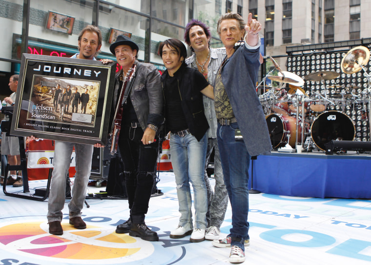 Image: Journey band members pose together after performing on NBC's Today Show in New York