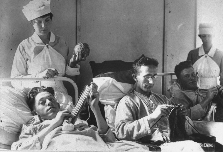 Bedridden wounded soldiers lying in beds