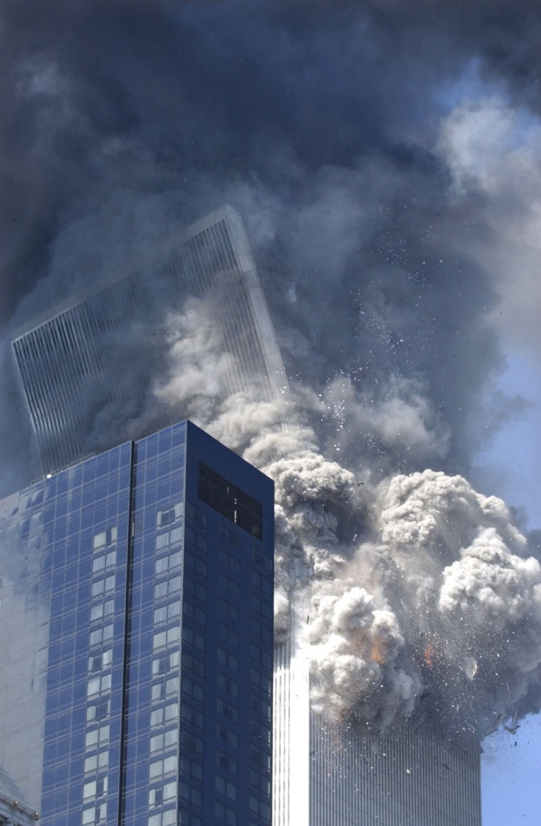 Smoke and debris fill the air in New York City as the south tower of the World Trade Center collapses at 9:59 a.m.  \"Clearly, not even the police and FBI who had flooded the area were worried about collapse,\" said George Hackett of Newsweek. \"They wouldn't have been anywhere near to the buildings as they were. If the first building hadn't essentially fallen straight down, its crash could have killed hundreds standing, like me, a few blocks away.\"

END msnbc.com caption 

** FOR USE AS DESIRED IN CONECTION WITH SEPT. 11 ANNIVERSARY--FILE **The south tower of the World Trade Center begins to collapse following a terrorist attack on the New York landmark in this Sept. 11, 2001 file photo. (AP Photo/Amy Sancetta, File)