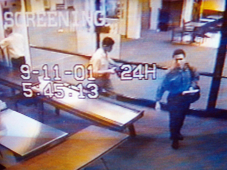 This video image from Portland International Jetport security released by the Portland, Maine, Police Department 19 September, 2001, reportedly shows suspected hijackers Mohammed Atta (R) and Abdulaziz Alomari (C) as they pass through airport security 11 September, 2001, at 5:45:13am. Authorities said the two men boarded a commuter flight to Boston before connecting to American Airlines Flight 11, one of four jetliners hijacked on 11 September and crashed into New York's World Trade Center.  AFP PHOTO/PORTLAND POLICE DEPARTMENT
