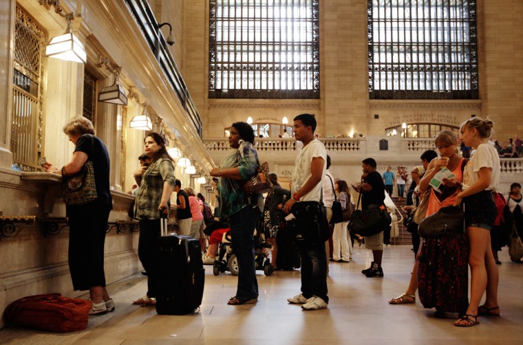 Image: Travelers wait in line for Metro North tickets at New York's Grand Central Station