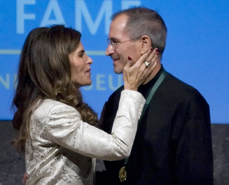 Image: File photo of Shriver kissing Jobs, CEO of Apple Inc., after being inducted into California Hall of Fame in Sacramento