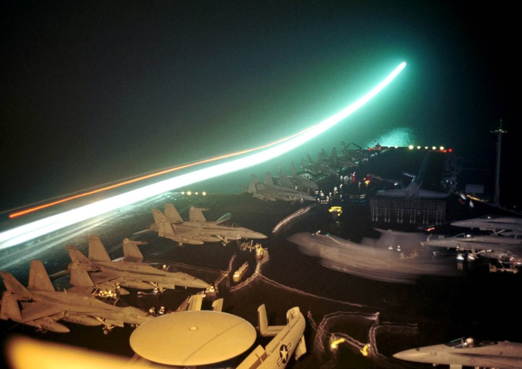 STREAK OF LIGHT AS PLANE TAKES OFF FROM USS ENTERPRISE