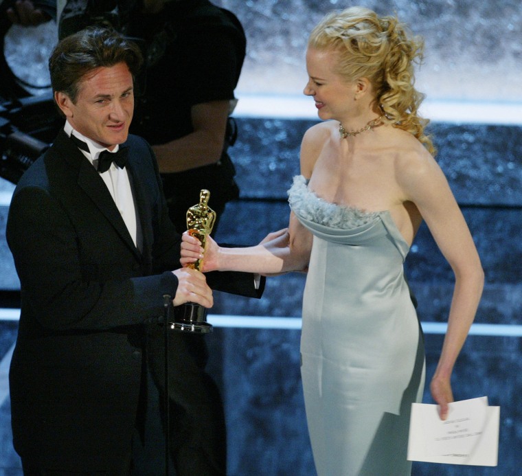 Image: Sean Penn accepts the Oscar for Best Act