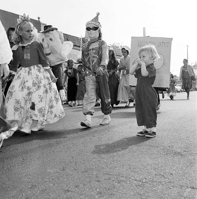Pictured here are elementary school children at the Halloween festival in Anaheim, Calif., Oct. 20, 1962. As part of the festival, nearly everyone  turns out to watch the parade, and thousands are on hand to watch the show that launches it at the Palma Stadium. Another 7,000 or more school children take part in a youngsters' parade and there is breakfast for 2,000 costumed citizens.  (AP Photo)
