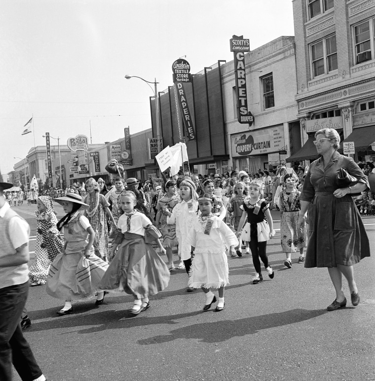 Pictured here is the Halloween festival in Anaheim, Calif., Oct. 20, 1962. Nearly everyone  turns out to watch the parade, and thousands are on hand to watch the show that launches it at the Palma Stadium. Another 7,000 or more school children take part in a youngsters' parade and there is breakfast for 2,000 costumed citizens.  (AP Photo)