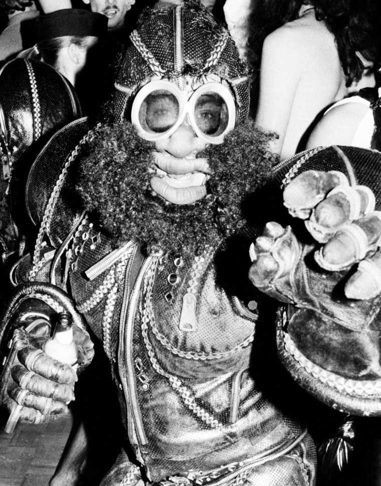 Bug-eyed monsters from outer space and pharaohs from ancient Egypt vie for attention at the Halloween party at Studio 54, Tuesday, Nov. 1, 1978, New York. The man shown is unidentified. (AP Photo/Richard Drew)