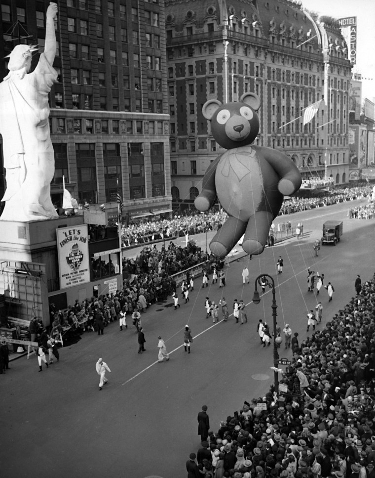 This was the scene at Times Square in New York during the annual Macy's Thanksgiving Parade, Nov. 23, 1945. It's the first parade since the festivities were suspended with the war in 1941. Here, the Teddy Bear passes a reproduction of the Statue of Liberty.