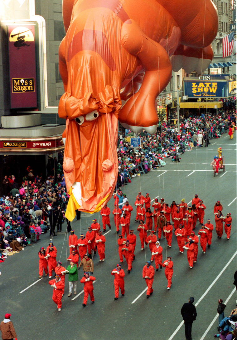 Rex displays a droopy face after the helium-oxygen filled balloon popped during the 67th annual Macy's Thanksgiving Day Parade down Broadway at 53rd Street in New York City, Thursday, Nov. 25, 1993.  The 85-foot balloon, the longest in the parade, is one of several which burst in the blustery winds and freezing temperatures.  (AP Photo/Kathy Willens)