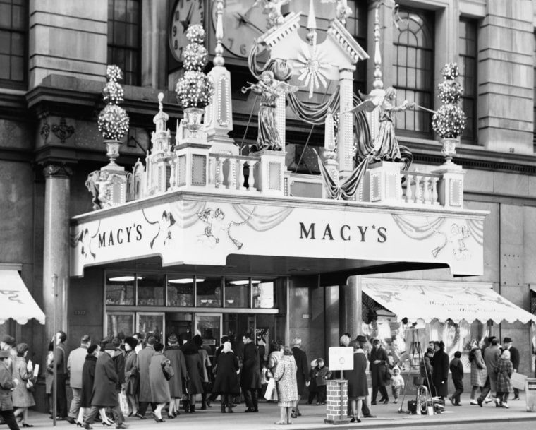 Group of people outside a department store Macy's New York City New York State USA. Photo by: Superstock/Everett Collection(255-16109A)