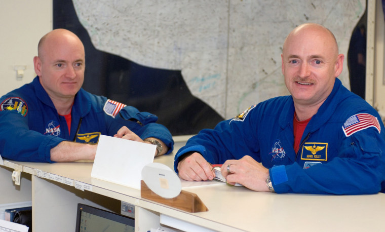 JSC2008-E-038906 (6 May 2008) --- Astronauts Mark Kelly (right), STS-124 commander, and Scott Kelly are pictured in the check-out facility at Ellington Field near NASA's Johnson Space Center as the STS-124 crewmembers prepare for a flight to Kennedy Space Center in NASA T-38 trainer jets.