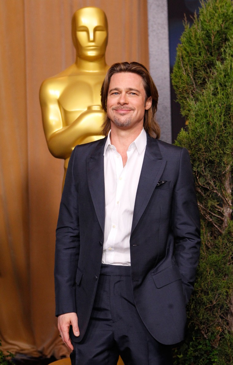Image: Actor Brad Pitt, best actor nominee for his role in \"Moneyball\", arrives at the 84th Academy Awards nominees luncheon in Beverly Hills