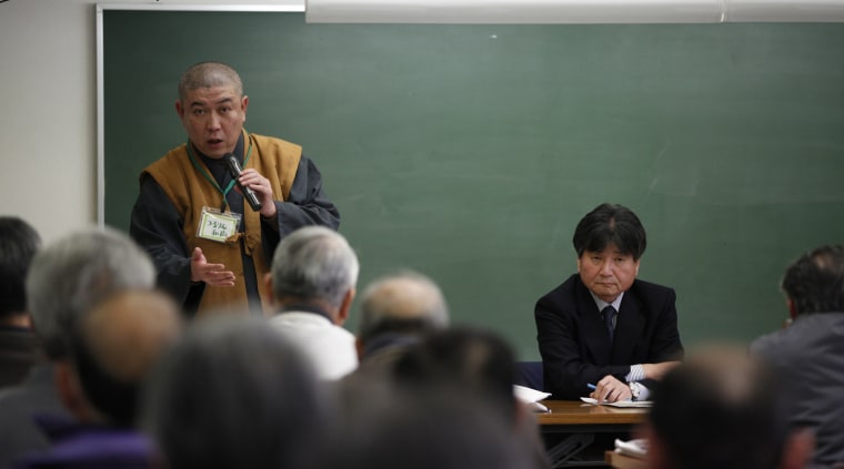 Image: Koyu Abe, a Zen priest, gives a lecture during a workshop to inform the local residents on how to deal with radioactive contamination in Fukushima