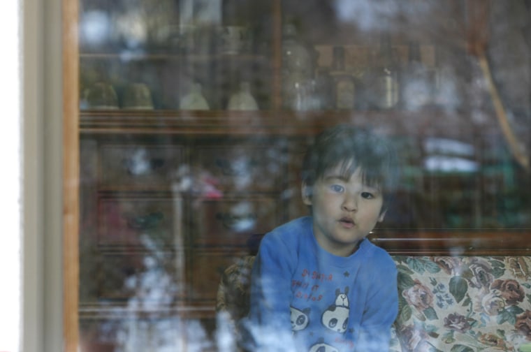 Image: Hisashi Abe, 3, he plays inside his grandparents' house near Joenji temple in Fukushima, northern Japan